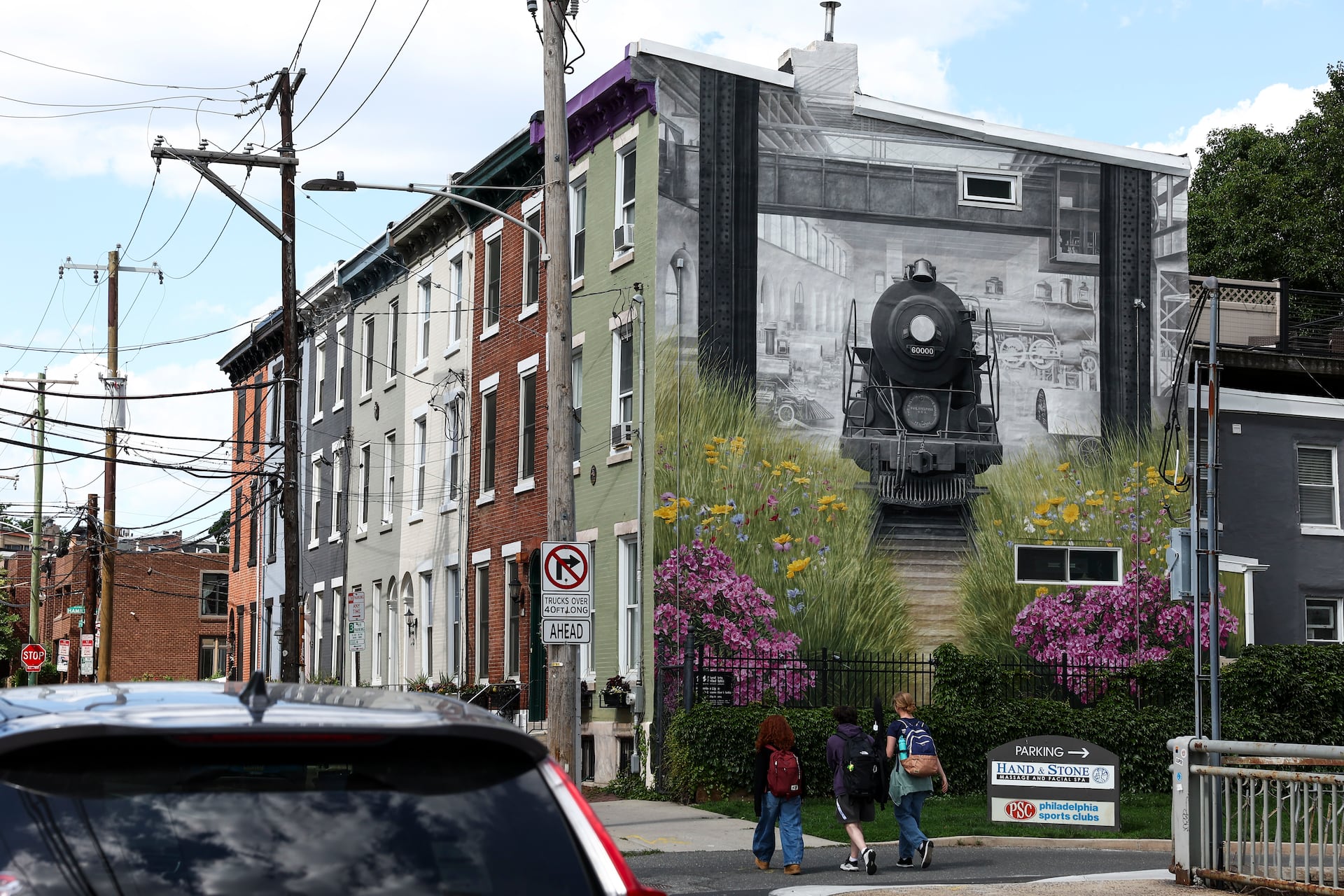This mural by Phillip Adams pays tribute to Baldwin Locomotive Works and the Lenape.