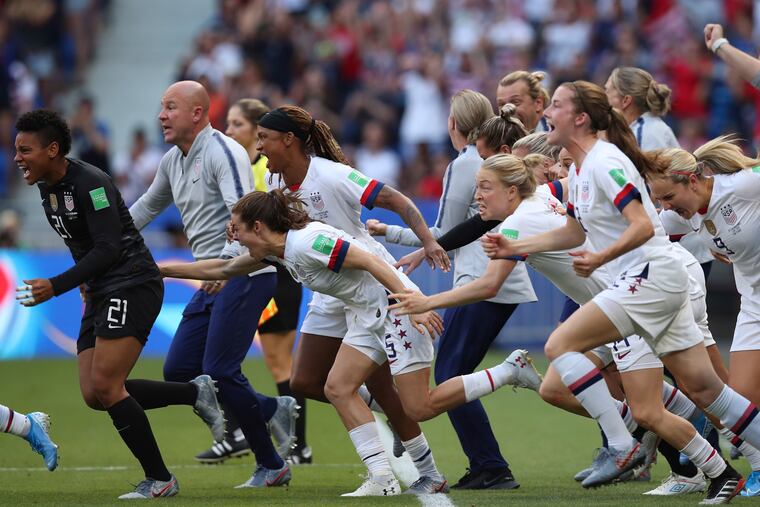 Kelley O'Hara (No. 5) and Tierna Davidson (second from right) led the charge onto the field at the final whistle of this summer's World Cup final.