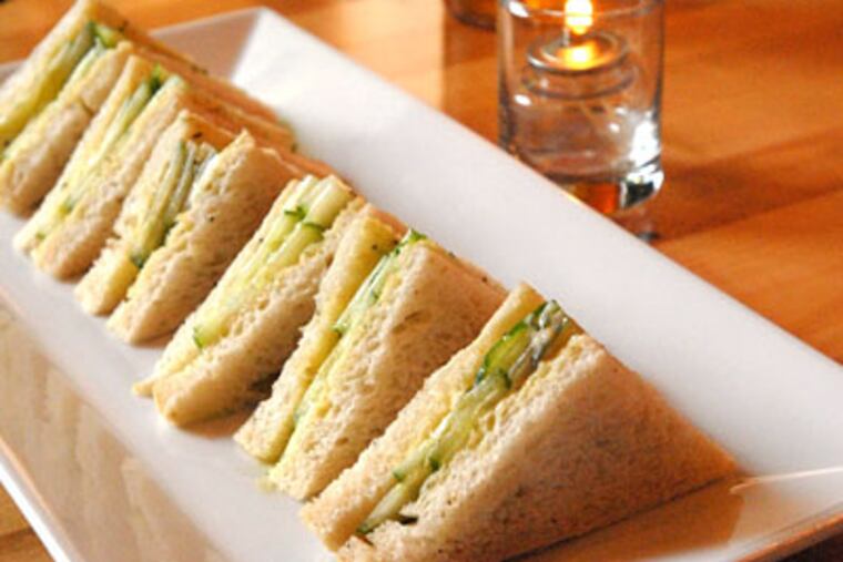 Cucumber sandwiches are a tasty, if dainty, homage to the comfort food of an owner's childhood home in Ireland. (APRIL SAUL / Staff Photographer)