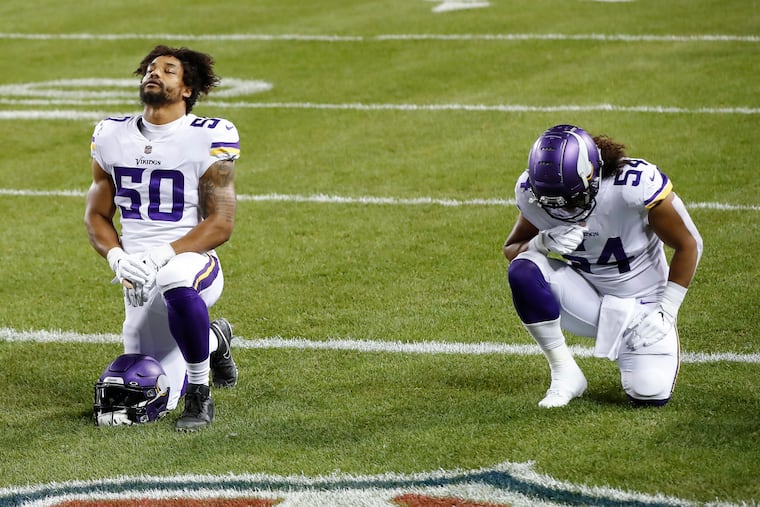 New Eagles linebacker Eric Wilson was No. 50 in Minnesota and will wear that number with the Eagles as well. Here he prays with then-teammate Eric Kendricks before a game last season against the Bears.
