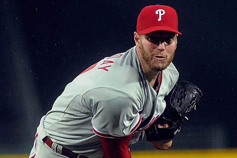 Phillies pitcher Roy Halladay works against the Atlanta Braves during the first inning. (John Amis/AP)