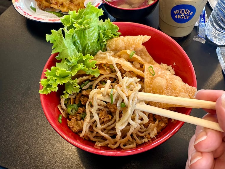 The bakmie ayam at Griddle & Rice is a classic Indonesian dish that blends chewy housemade noodles with two kinds of chicken, sweet and savory, and a soy-based seasoning flavored with chicken and garlic oil.