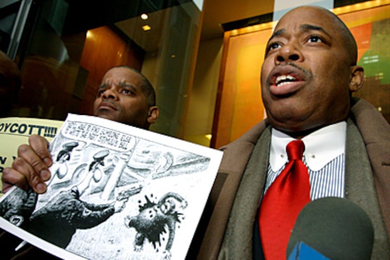 New York State Sen. Eric Adams stands in front of the New York Post building holding a cartoon that ran in the newspaper on Wednesday. Some have interpreted the cartoon to compare President Barack Obama to a violent chimpanzee gunned down by police. (AP Photo / Craig Ruttle)
