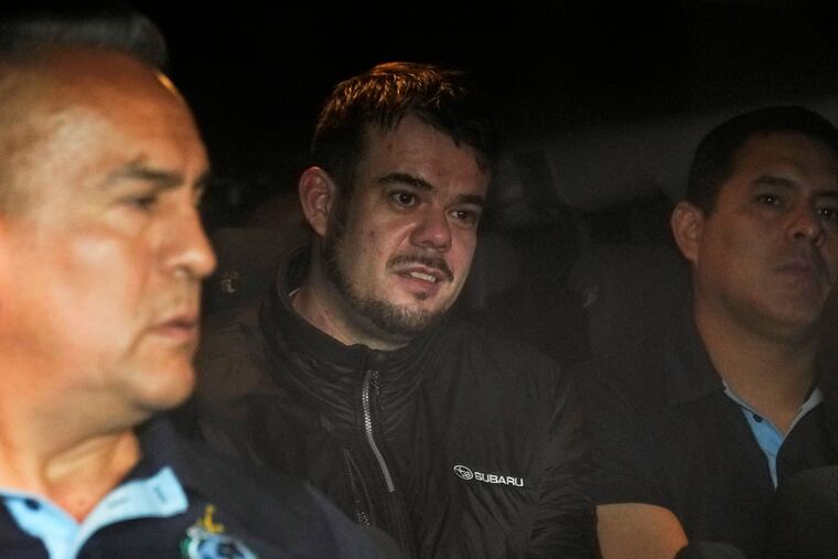 FILE - Dutch citizen Joran van der Sloot is driven in a police vehicle from a maximum-security prison to an airport to be extradited to the U.S., on the outskirts of Lima, Peru, Thursday, June 8, 2023. Van der Sloot, the chief suspect in Natalee Holloway’s 2005 disappearance, is scheduled to appear in court Wednesday morning, Oct. 18, where he is expected to plead guilty to trying to extort money from her mother and provide new information about what happened to the missing teen. (AP Photo/Martin Mejia, File)