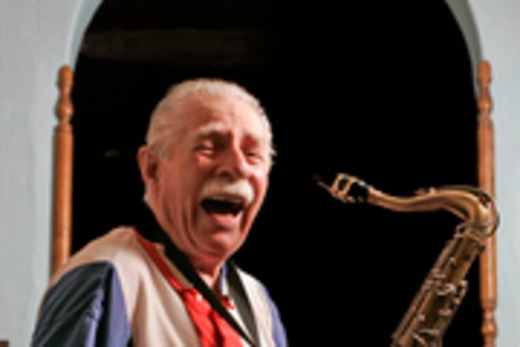 "I feel young. I think young," says James "Rip" McDonald, 84, of Bridesburg, preparing to play in his final Mummers Parade. At left, he certainly looked in the pink in 1964, 26 years after his debut.