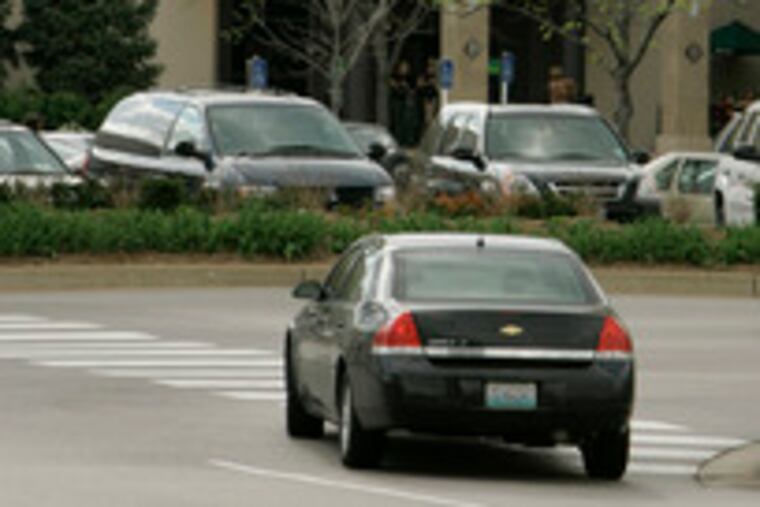 A car pulls up to the St. Louis Galleria, which is imposing restrictions on patrons 16 and under who are not accompanied by an adult. At least 44 U.S. malls have teen curfew and escort policies.