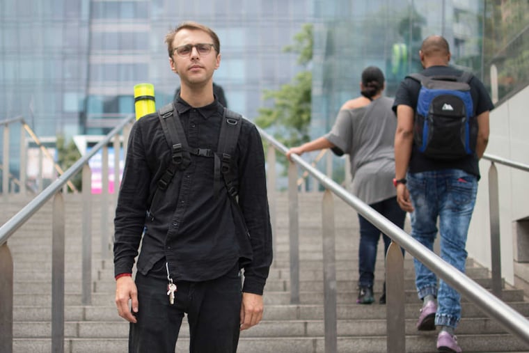 Ryan Greenberg at the SEPTA station at Philadelphia city hall. Photographer. Greenberg, 27, filling empty frames with art.