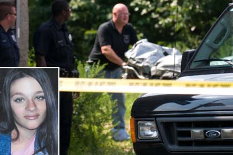 Police remove the body of Jenna Lord from a vacant lot in Camden after family members discovered it during a search. (Kriston J. Bethel / Staff Photographer)