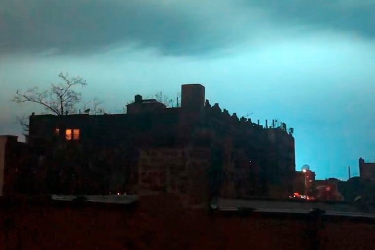 In this image taken from video, the night sky is illuminated in a bright, blue color after an explosion in the Queens borough of New York, Thursday, Dec. 27, 2018. (AP Photo/Sophie Rosenbaum)