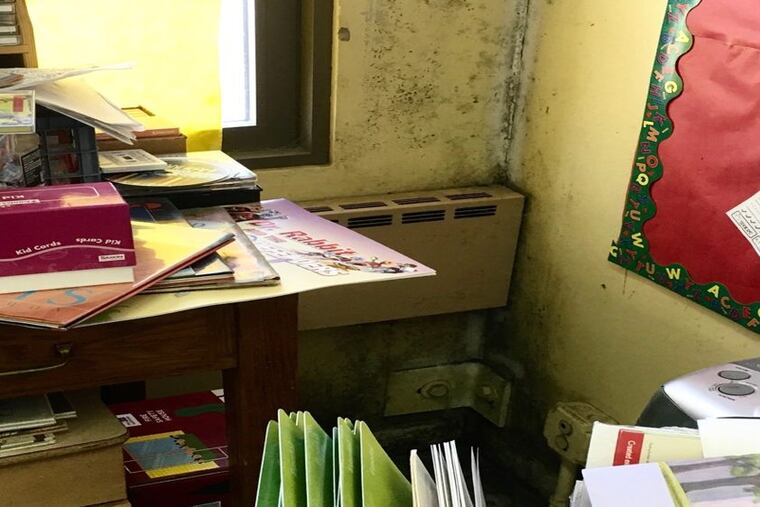 A moldy Philadelphia district elementary school classroom in need of repair.