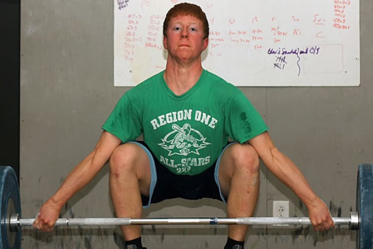 Ricky Beaver, a junior from La Salle College HS who will compete later
this month in USA Weightlifting's junior national championships in
Colorado, works out at the Liberty Barbell Club in Philadelphia. (Lou Rabito/Staff)