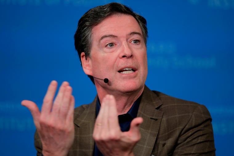 FILE - Former Director of the Federal Bureau of Investigation James Comey at Harvard University's Institute of Politics' JFK Jr. Forum in Cambridge, Mass., Feb. 24, 2020. (AP Photo/Charles Krupa, File)