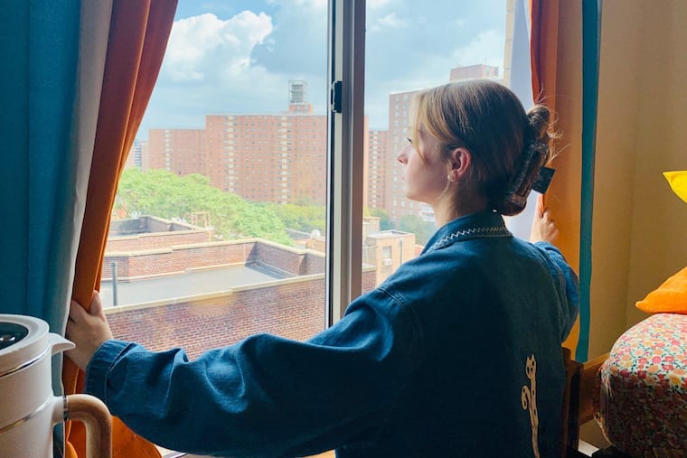 Kate Jones, 18, of Lambertville, N.J., looks out upon New York City from her dorm room at the Manhattan School of Music, where she's a freshman.