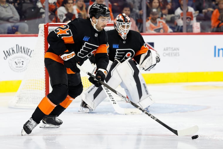 Flyers left wing Noah Cates skates with the puck against the Detroit Red Wings on Dec. 12.