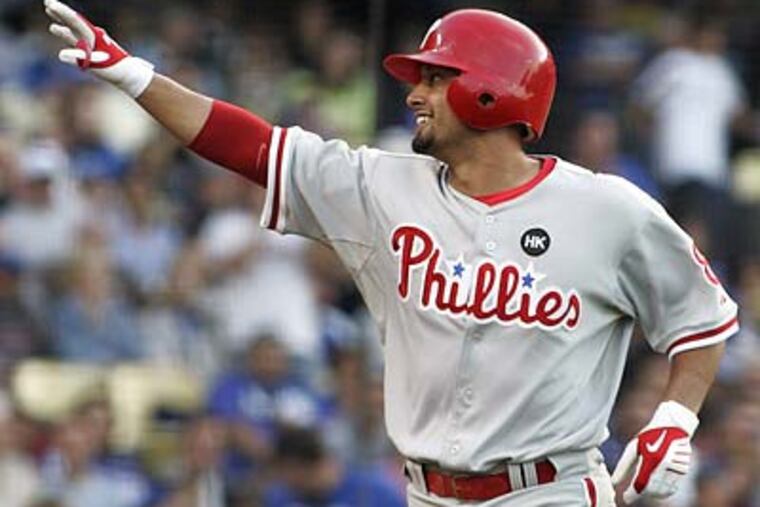Shane Victorino and the Phillies had reason to smile after last night's win. (Lori Shepler / AP)