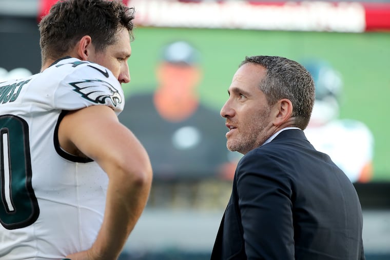 Eagles GM Howie Roseman (right) talks with Eagles punter Arryn Siposs before the Philadelphia Eagles play the Cleveland Browns at Lincoln Financial Field in Philadelphia, Pa. on Thursday, Aug. 17, 2023.