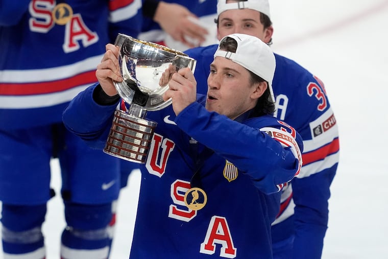 United States forward Ryan Leonard (9) hoists the trophy following their IIHF World Junior Hockey Championship gold medal game win over Finland.