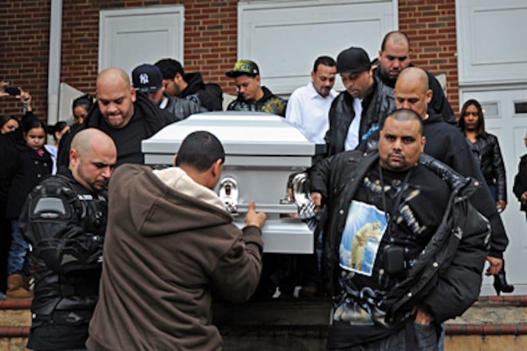 At St. Anthony of Padua Church, mourners carry the coffin of Angel Luis Velazquez, 35, who was shot and killed in Camden on Nov. 29. (April Saul / Staff Photographer)