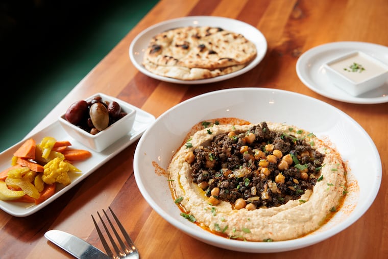 The Turkish hummus is topped with ground beef, clarified butter, and chickpeas at Renata’s Kitchen.