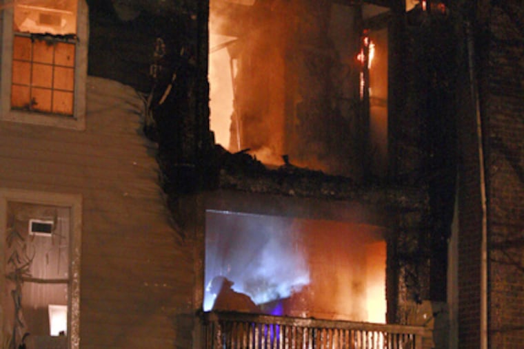 Philadelphia firefighters fight a 2-alarm fire at Lincoln Green apartment complex, 4040 Presidential Blvd. in Philadelphia. (Elizabeth Robertson / Staff Photographer)