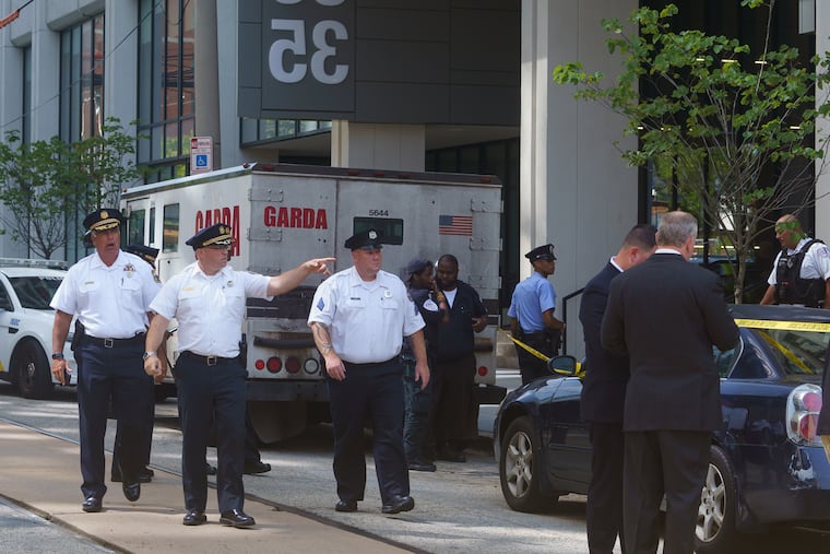 Police investigate an armored truck robbery at 36th and Market Streets in Philadelphia on Thursday, Aug. 1, 2019.