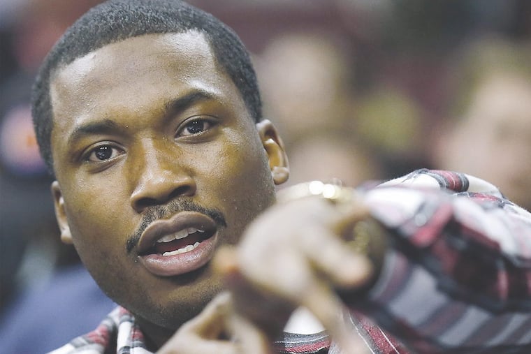 Hip-hop artist Meek Mill attends as the Philadelphia 76ers play host to the Sacramento Kings on Wednesday, Feb. 10, 2016, at the Wells Fargo Center in Philadelphia.