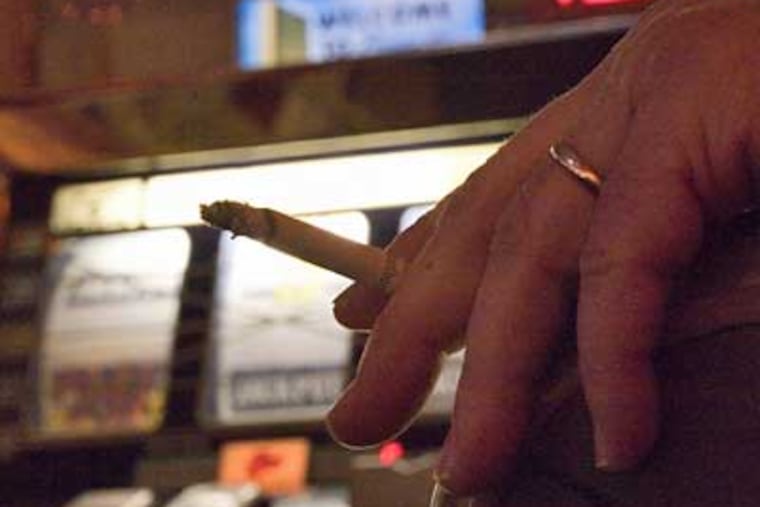 PhiladelphiaPark in Bensalem said Monday it will become the first casino in the state to allow smoking on one-half of its casino floor. (David M Warren / Staff Photographer)