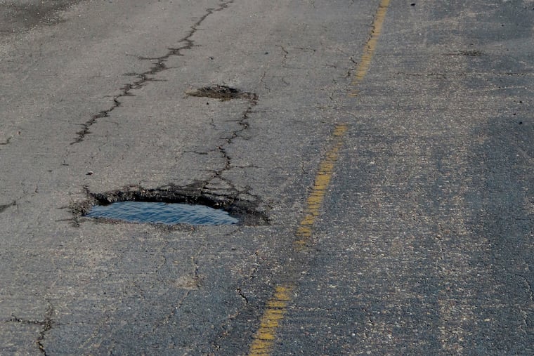 A pot-holed runway at the former Bader Field airport site is backdropped by casinos in February in Atlantic City.