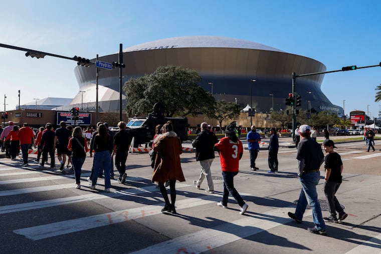 Fans walk towards the Caesars Superdome ahead of the Sugar Bowl NCAA College Football Playoff game on Jan. 2. The stadium will host the Super Bowl game between the Eagles and Chiefs on Feb. 9.