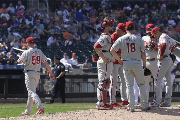 Starter Mark Leiter Jr. (left) leaves the game in the fourth inning.