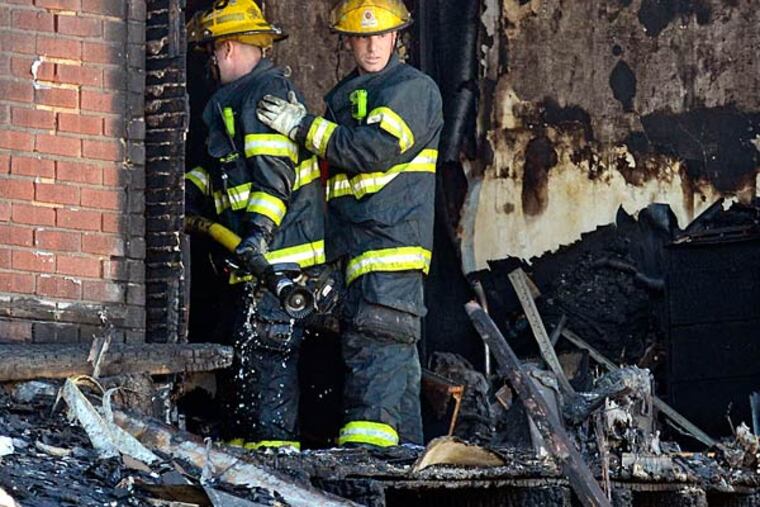 Firefighters who responded to the Southwest Philly fire on July 5 are still facing blame despite released 9-1-1 logs and calls. TOM GRALISH / STAFF PHOTOGRAPHER