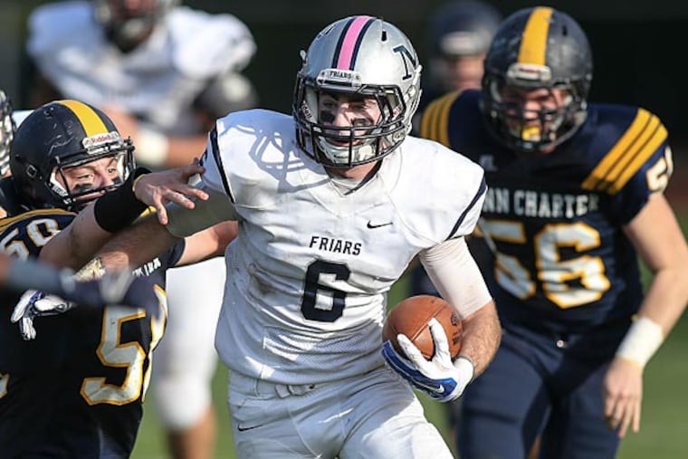 Malvern Prep's James Keating tries to shake Penn Charter's Luke Stansfield (50) after a screen pass. (Steven M. Falk/Staff Photographer)