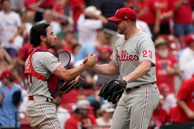 Phillies relief pitcher Corey Knebel (23) and catcher Garrett Stubbs celebrate a 1-0 victory over the St. Louis Cardinals.