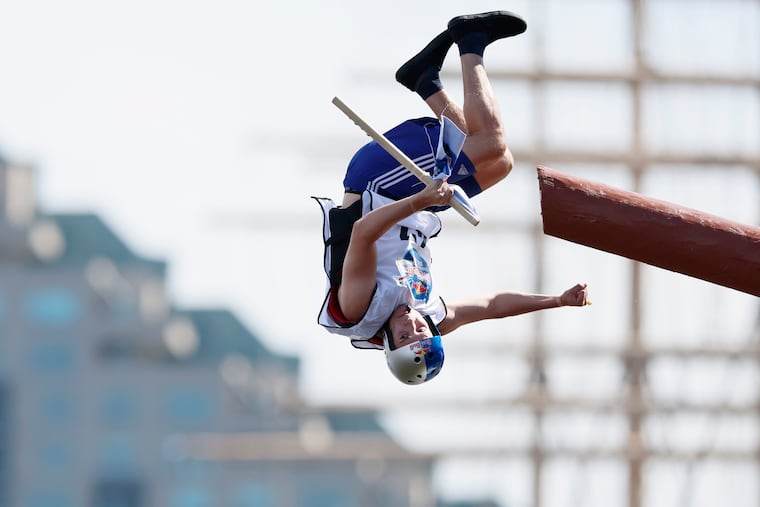 Keilan Barber grabbed the flag then did a flip into the water in the finals to win the Red Bull Run on Saturday at Spruce Street Harbor Park in Philadelphia.