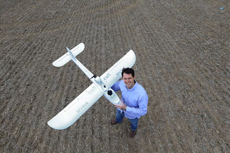 Dan Murray, founder of Unmanned Sensing Systems LLC, poses with one of his drones at Swede Run Fields in Moorestown, NJ on May 27, 2015. (DAVID MAIALETTI / Staff Photographer)