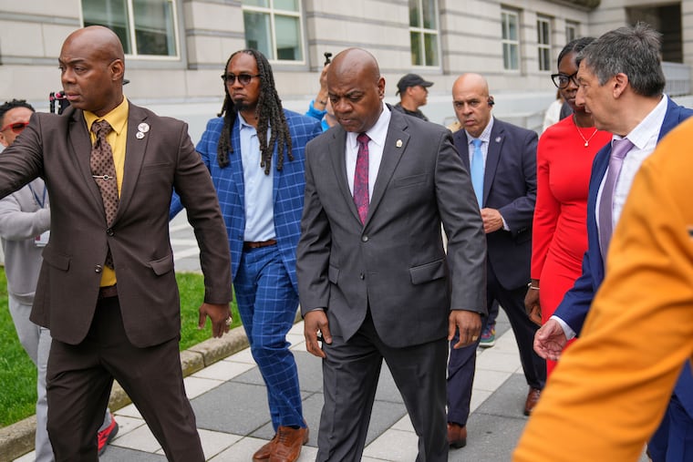 Newark Mayor Ras Baraka (center) leaves a court appearance in Newark, N.J., Thursday, May 15, 2025. Trespassing charges against Baraka, who is also running for New Jersey governor, were dropped after he attempted to join three members of Congress on an immigration detention center inspection.