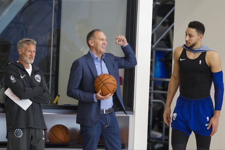 76ers president of basketball operations Bryan Colangelo, center, between coach Brett Brown and Ben Simmons.