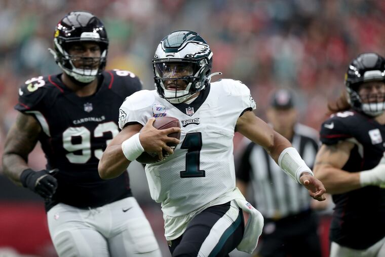 Eagles quarterback Jalen Hurts picks up a first down against the Cardinals in the second quarter Sunday in Glendale, Ariz.