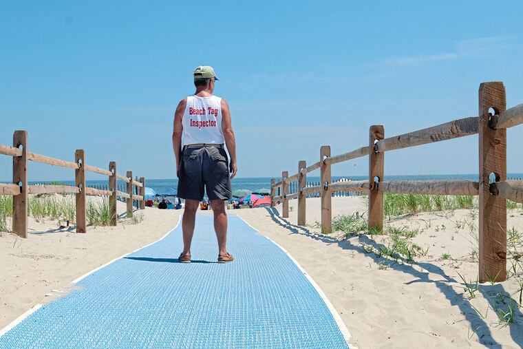 Joe McMaster, 72, retired from both the U.S. government and Rutgers University/Camden, works as a Beach Tag Inspector on the Promenade in Sea Isle City July 16, 2013. TOM GRALISH / Staff Photographer