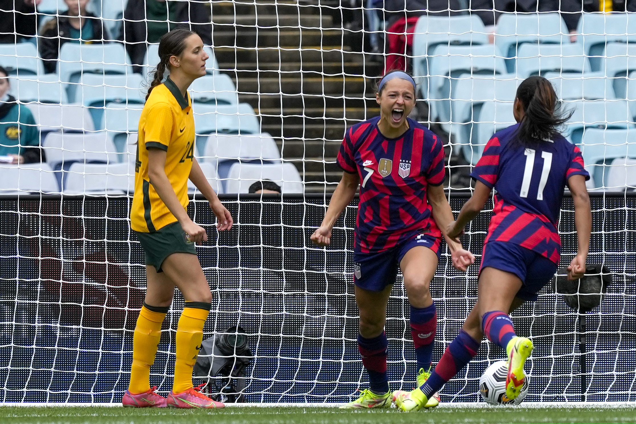 Ashley Hatch (center) celebrate after scoring for the U.S. against Australia.