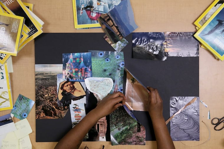 Inquirer staff writer Cassie Owens makes a travel vision board from old National Geographic magazines in the newsroom.