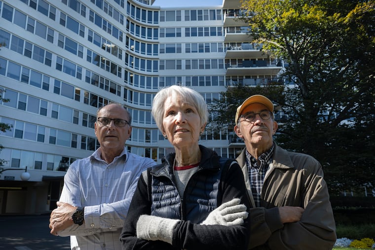 (From left) John Falgie, Sutton Terrace building manager, and residents Joan Ochroch and Bob Handler, outside the condominium tower in Lower Merion, Pa. Sutton Terrace stands at Belmont Avenue and St. Asaphs Road, where a proposed roundabout concerns residents in several large condo buildings in the area.