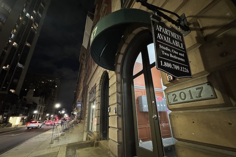 A sign advertises apartments for rent in a Center City building near Rittenhouse Square.