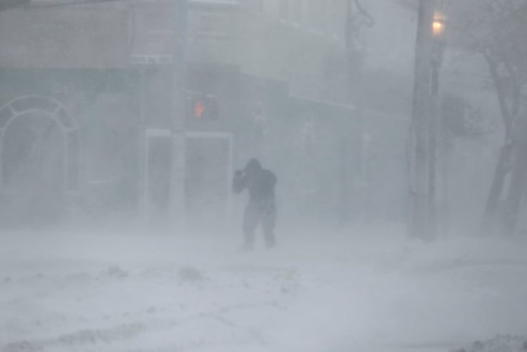 A man struggles to cross an Atlantic City street during the bomb cyclone that brought snow and high winds to the region four years ago.