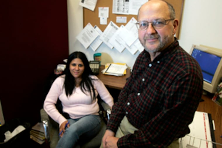 Bruce Dorpalen, Acorn Housing director of housing counseling, and Marisol Morales, a counselor, at their office in Philadelphia. He said he hoped any interest-rate freeze was "long enough that people really can restore their finances."