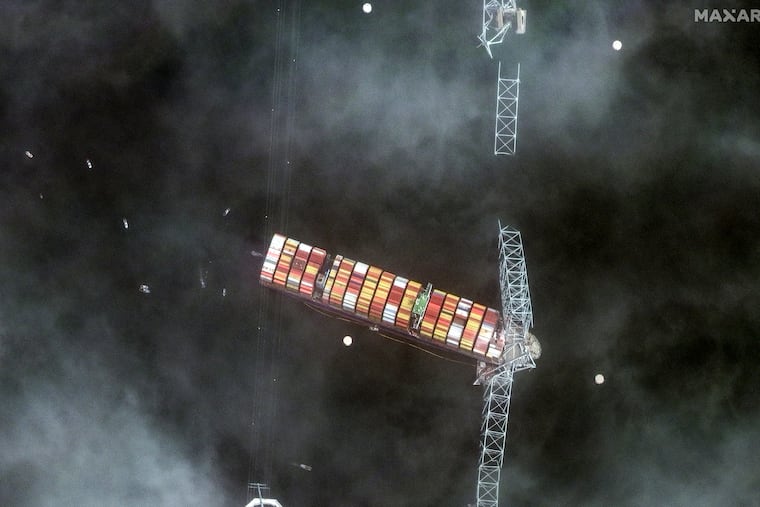 This satellite image provided by Maxar Technologies shows a view of the Francis Scott Key Bridge that was struck by a container ship in Baltimore on Tuesday, March 26, 2024. The container ship lost power and rammed into the major bridge, causing the span to buckle into the river below.
