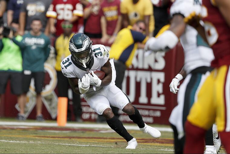 Eagles cornerback Jalen Mills intercepts a fourth-quarter pass against the Redskins.