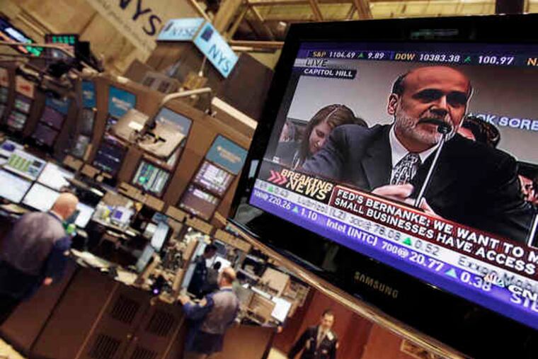 Fed Chairman Ben S. Bernanke's testimony before Congress is shown on a large TV on the floor of the New York Stock Exchange.