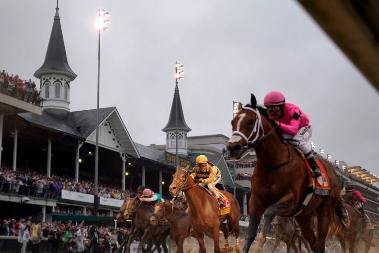 Luis Saez rode Maximum Security, right, to victory in last year's Kentucky Derby.