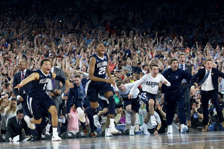 The Villanova bench storms the court after Kris Jenkins hit the game-winning shot as time expired to defeat North Carolina and win the NCAA Men's Basketball Championship at NRG Stadium in Houston on April 4, 2016.